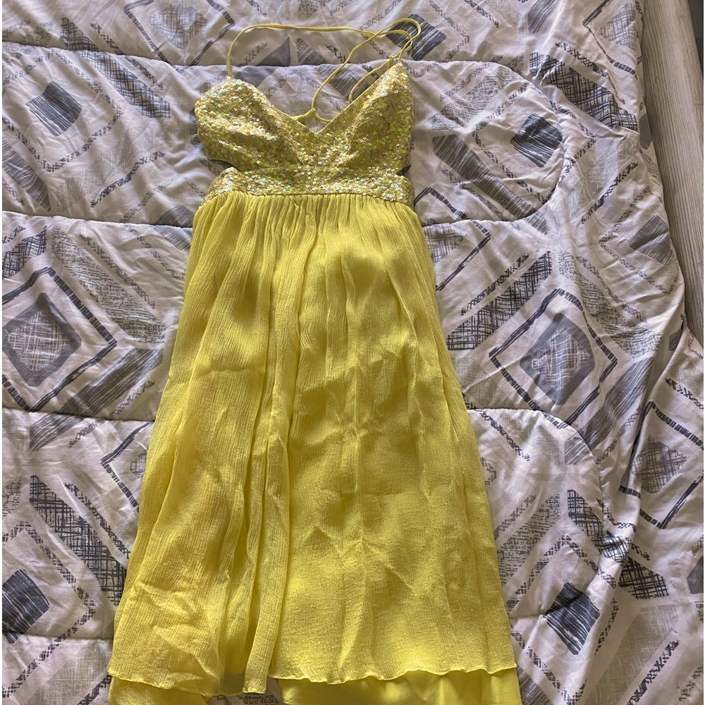 Yellow Sequin mini flowy dress with tie back and cut out top